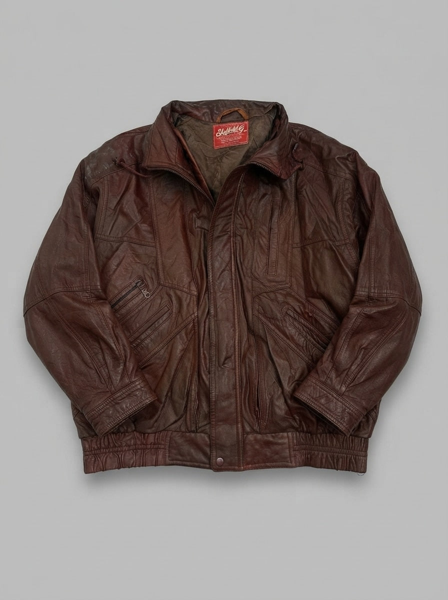 Burgundy leather Harrington jacket, size L, shown flat from the front. Storm flap over the centre zip and a shirred leather waistband.