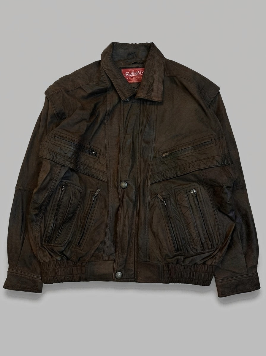 Brown leather flight jacket, size L, shown flat from the front. Pleated Zip Pockets.