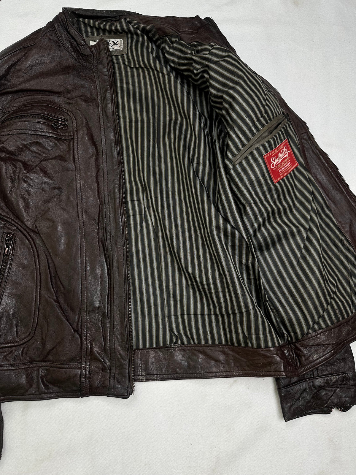 Welted zip chest pocket above a slanted hip pocket