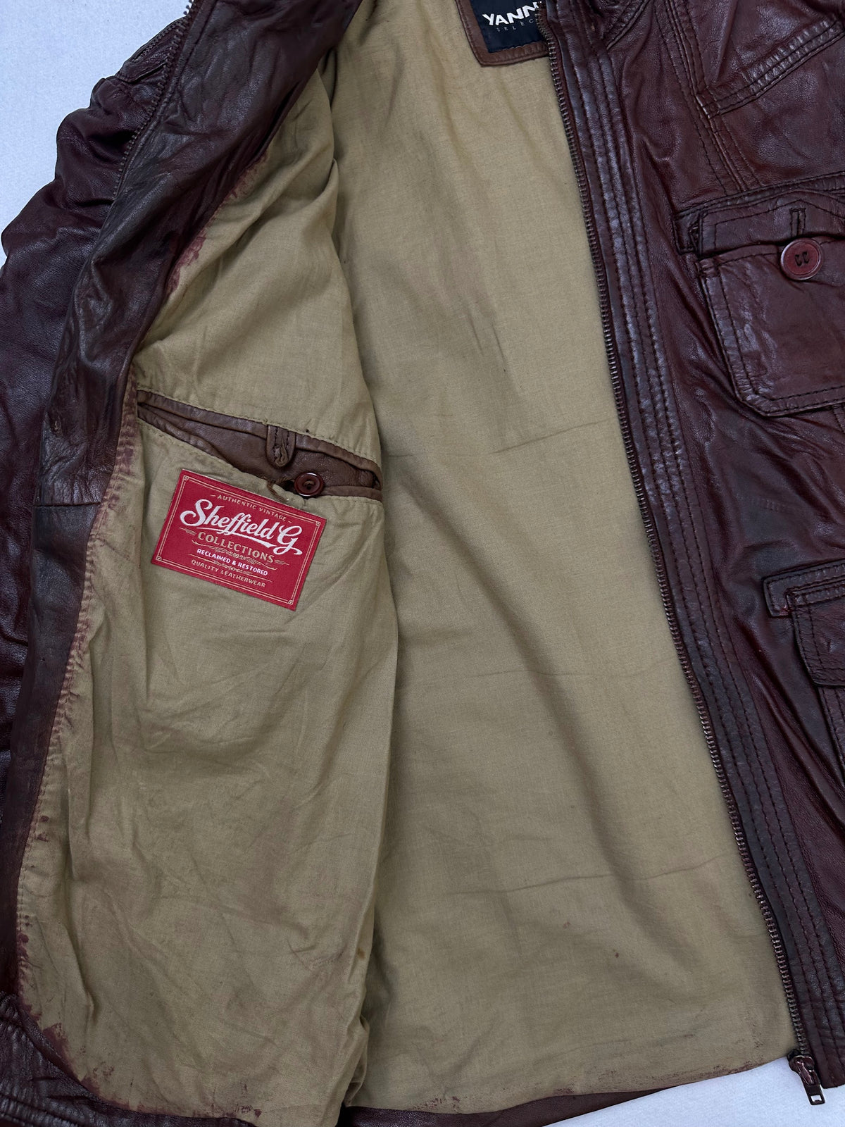 The size L burgundy leather field jacket opened to show the lining