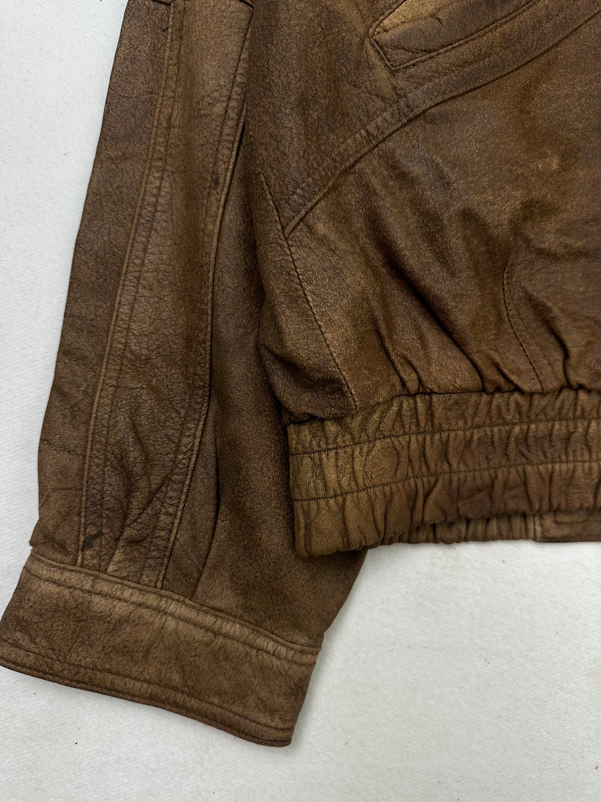 Close detail of the pockets and cuff on the size XL brown leather flight jacket