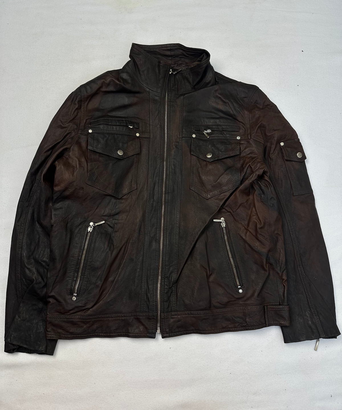 Front of the size L brown leather cafe racer jacket, laid flat and unedited