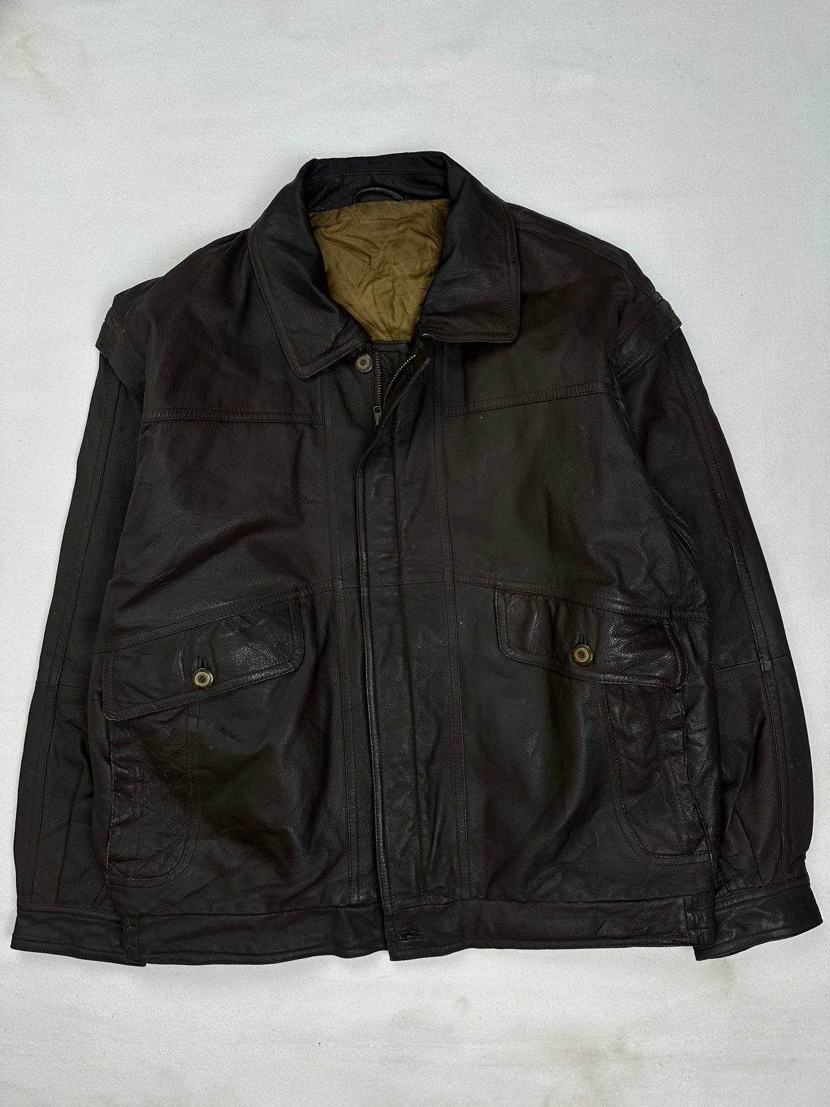 Back of the size XL brown harrington jacket laid flat