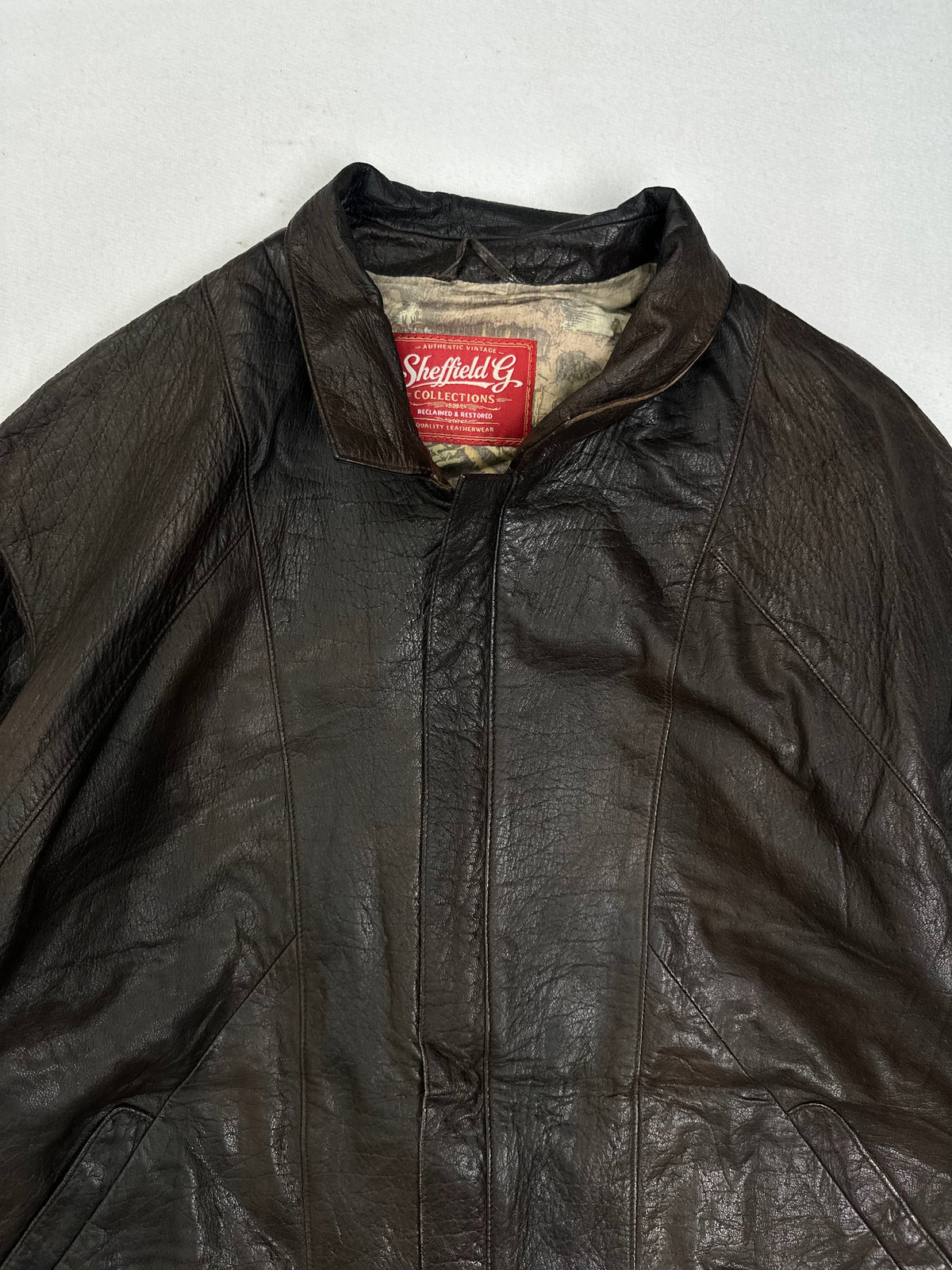 Printed cream and olive lining shown with the jacket open