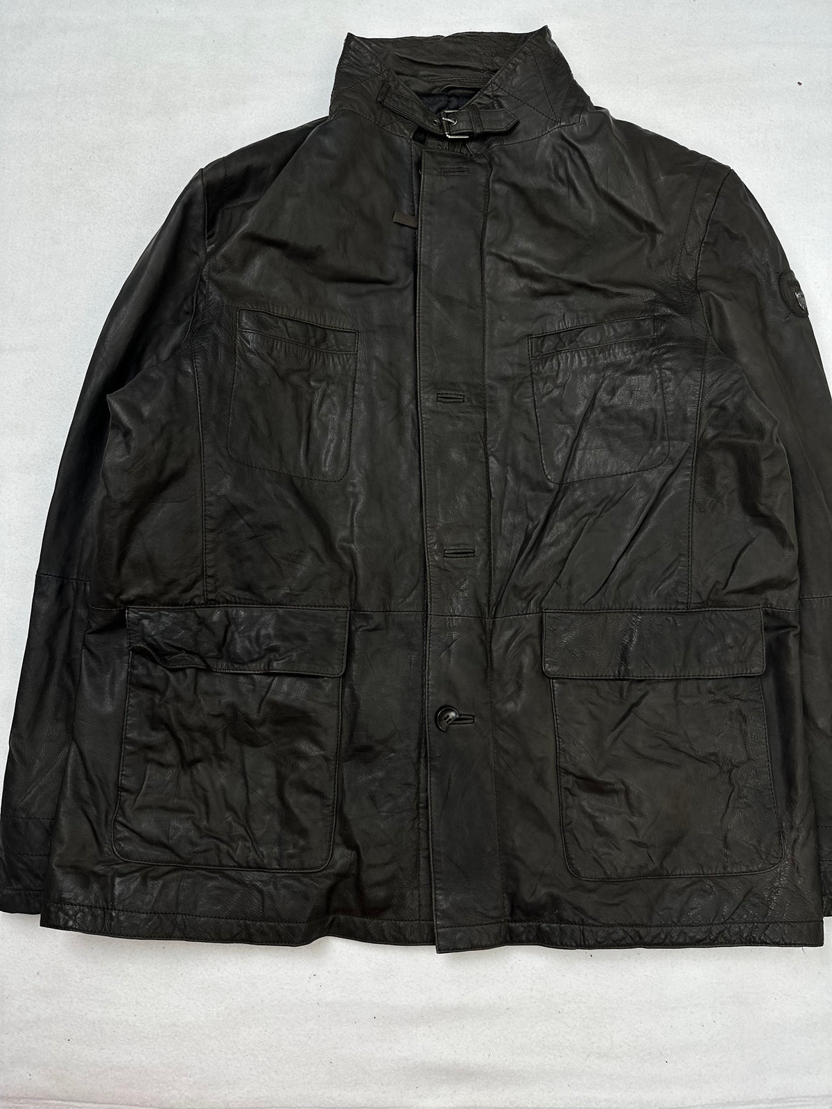Front of the size XL brown leather field jacket, laid flat and unedited
