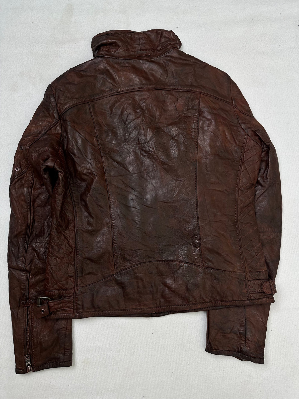 Back of the size S burgundy leather cafe racer jacket, laid flat