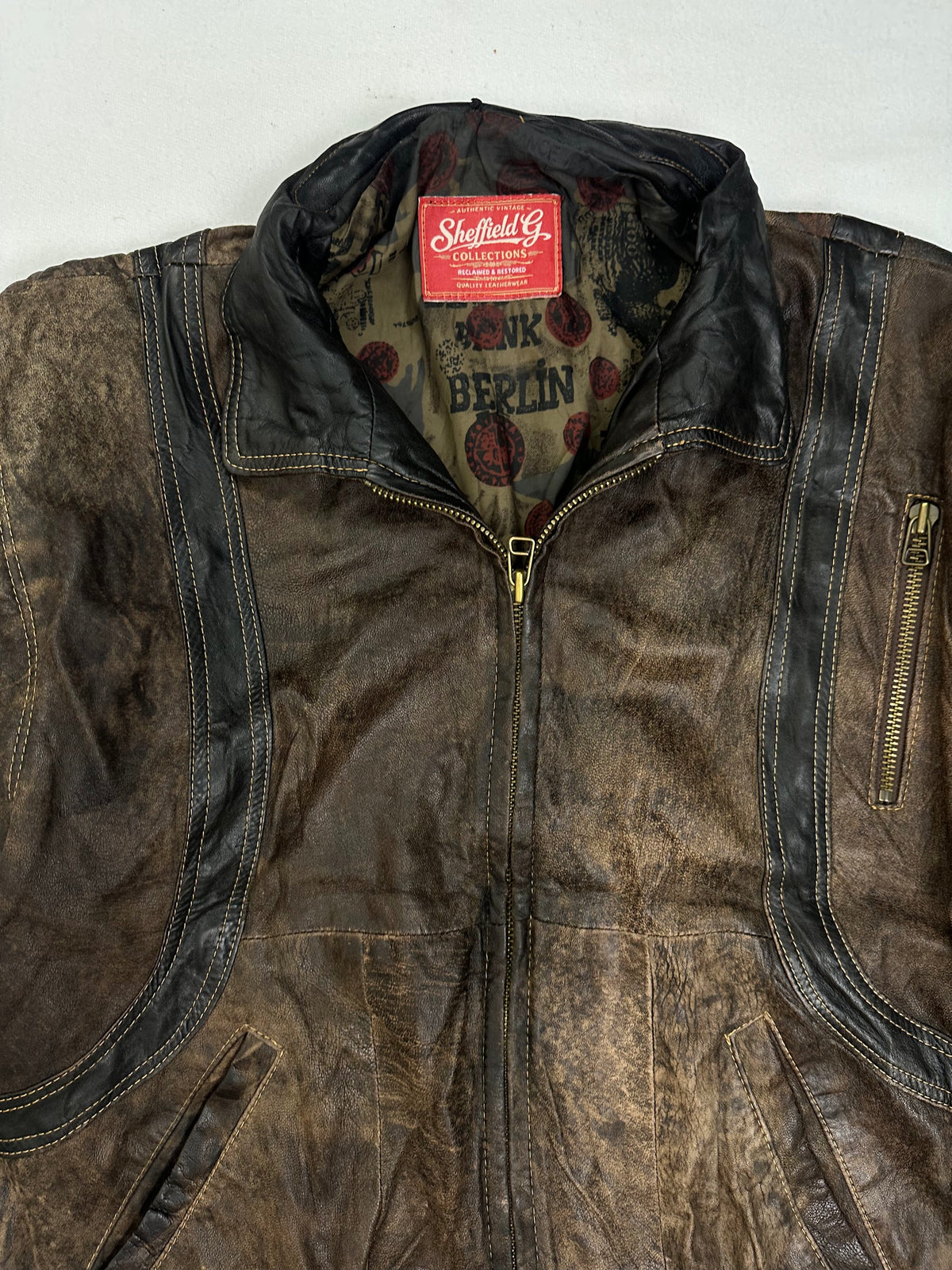 Printed olive lining shown with the harrington held open