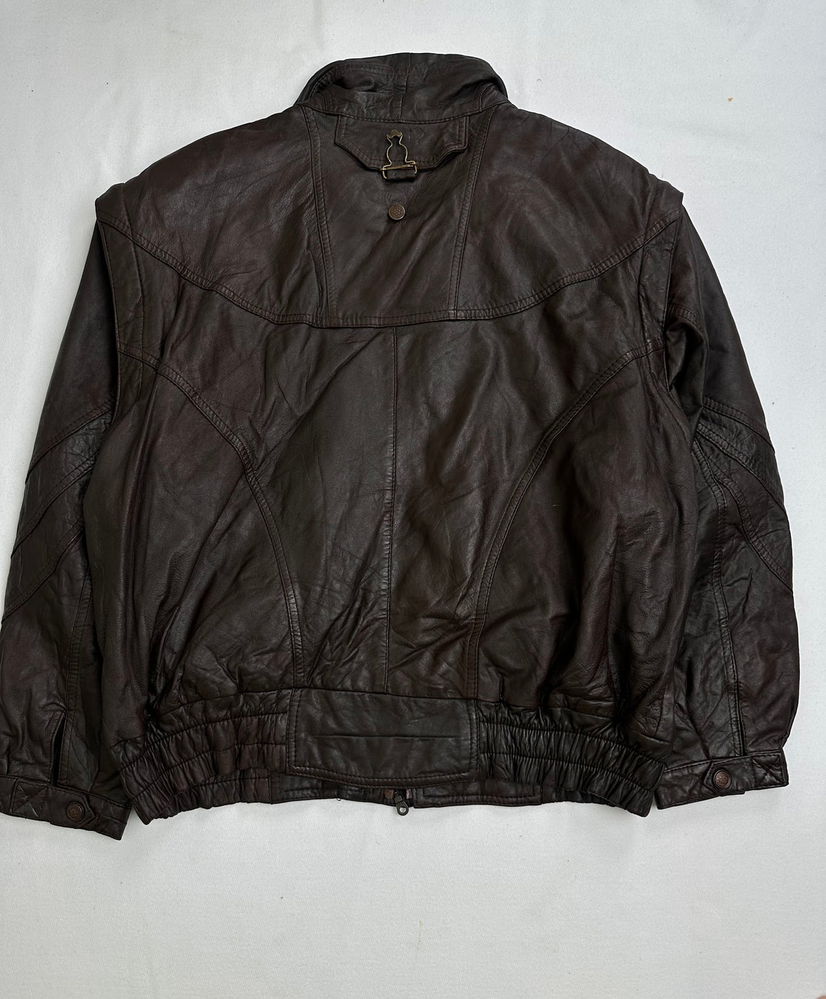 Funnel collar and its metal throat latch above the storm placket