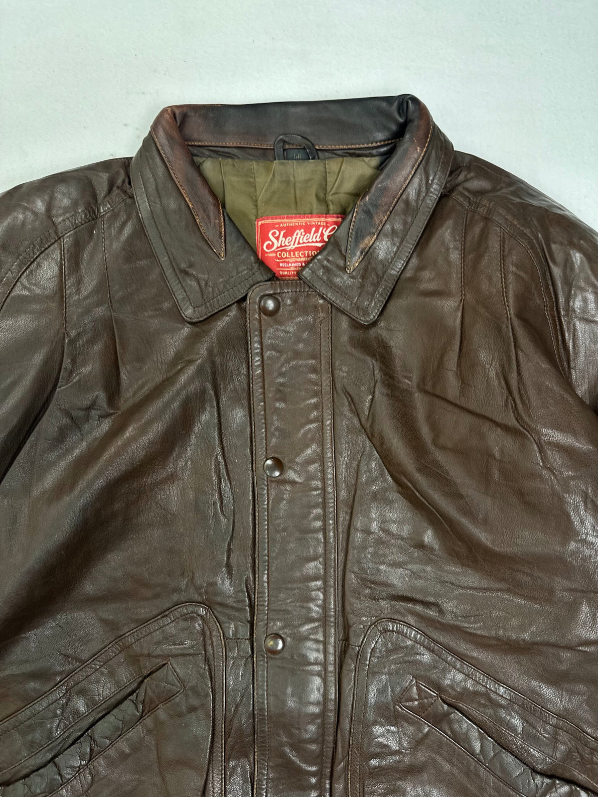 Bar tacked slanted welt pocket beside the shirred waistband