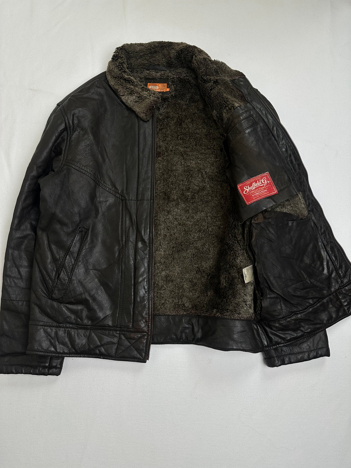 Full pile lining shown with the brown flight jacket held open