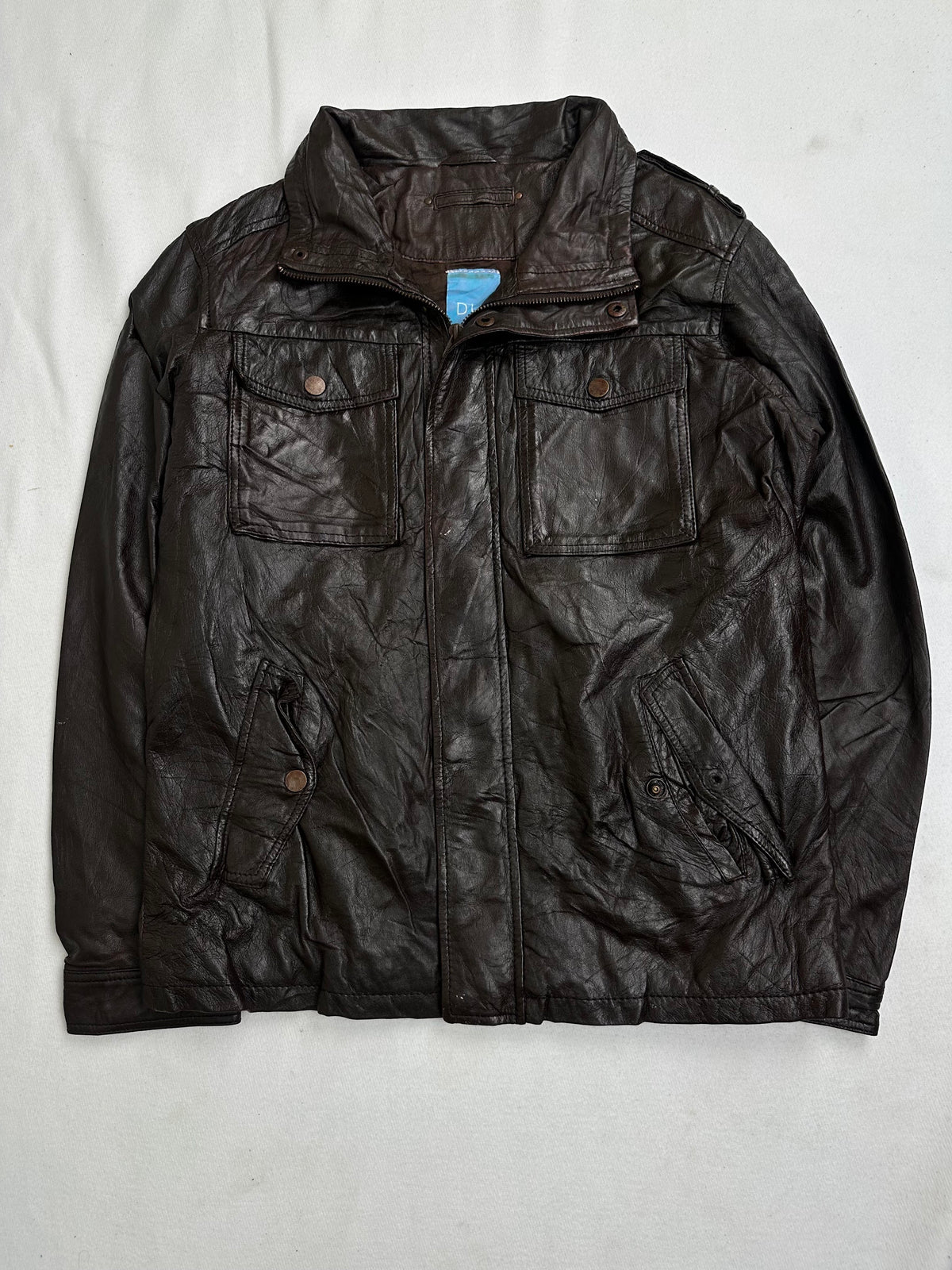 Back of the size L brown field jacket laid flat