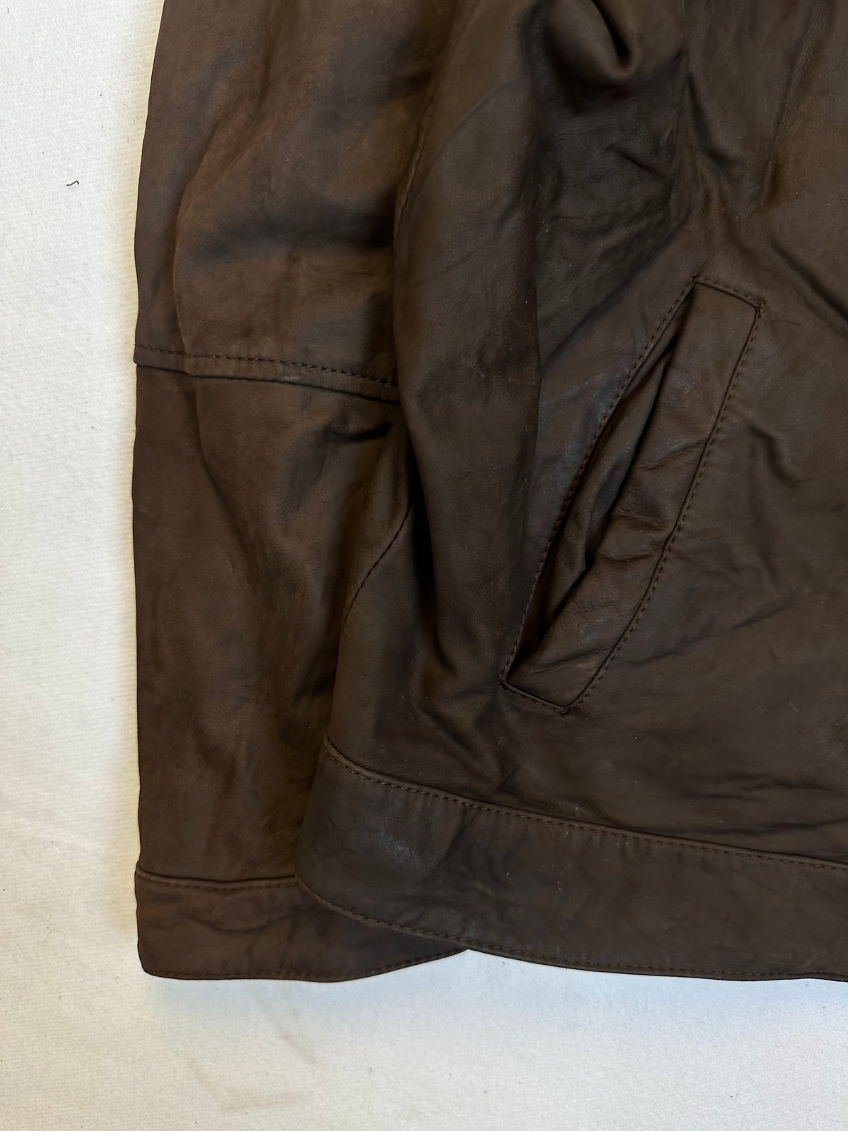 Close detail of the pockets and cuff on the size XL brown leather vintage jacket