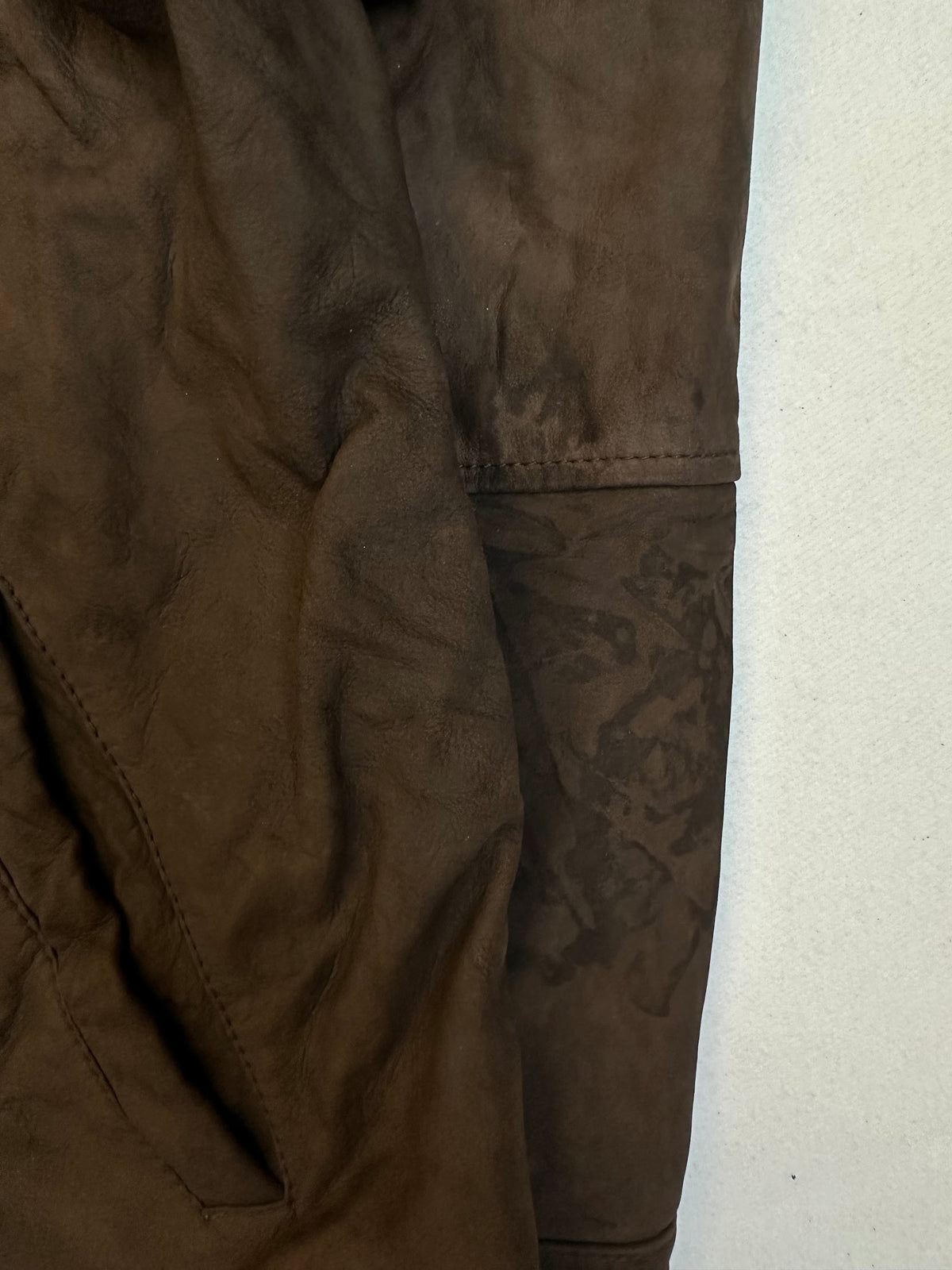 A small mark on the size XL brown leather vintage jacket, shown up close