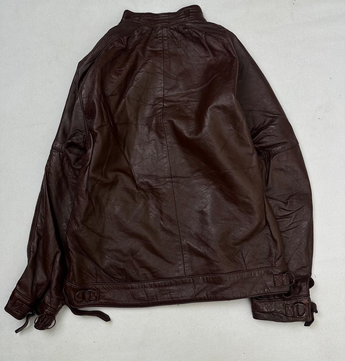 Back of the size L burgundy leather cafe racer jacket, laid flat