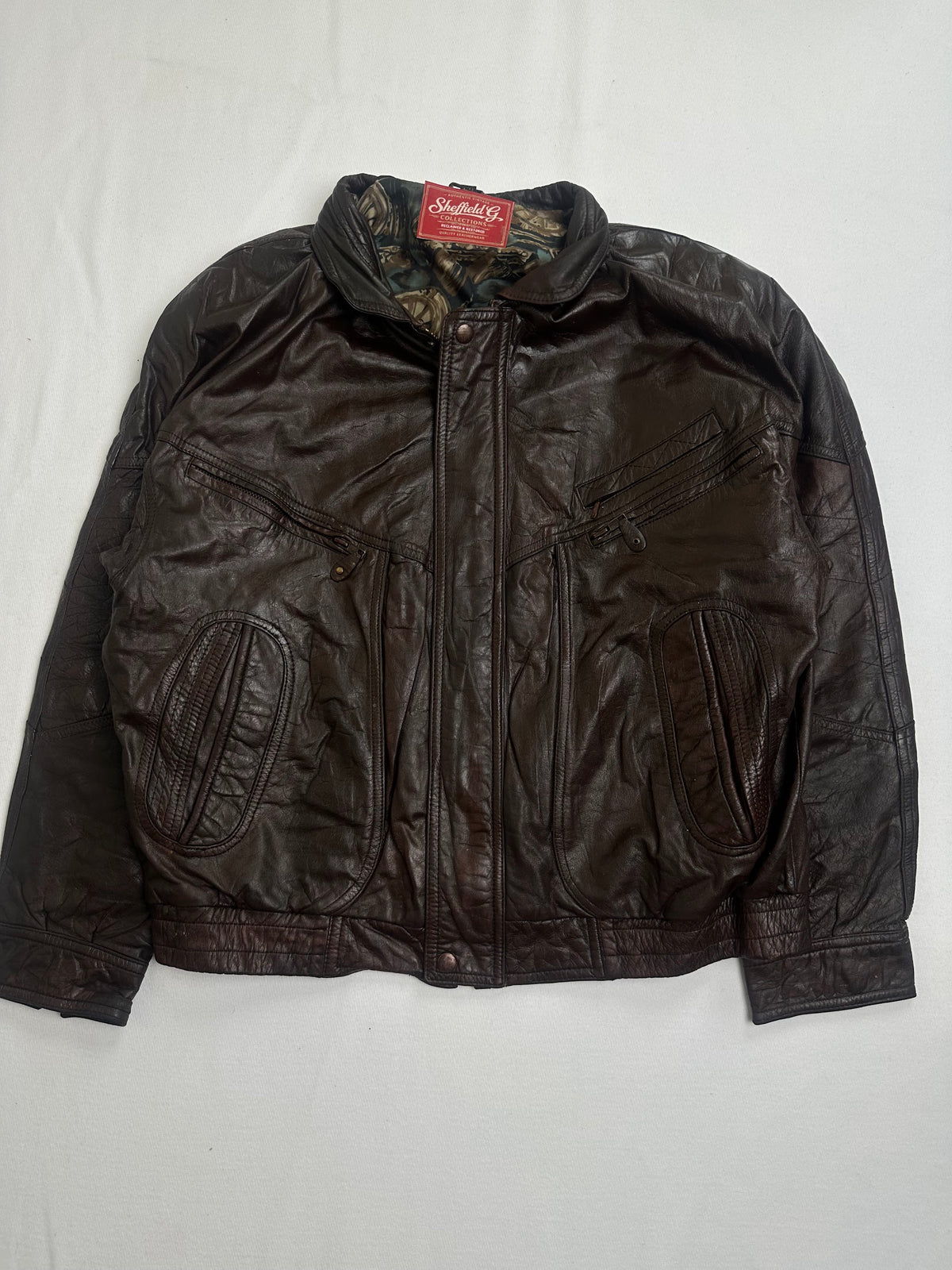 Back of the size L brown harrington laid flat and unbroken