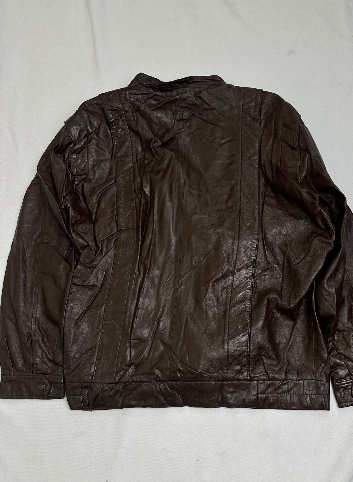 Olive pinstripe lining shown with the jacket held open