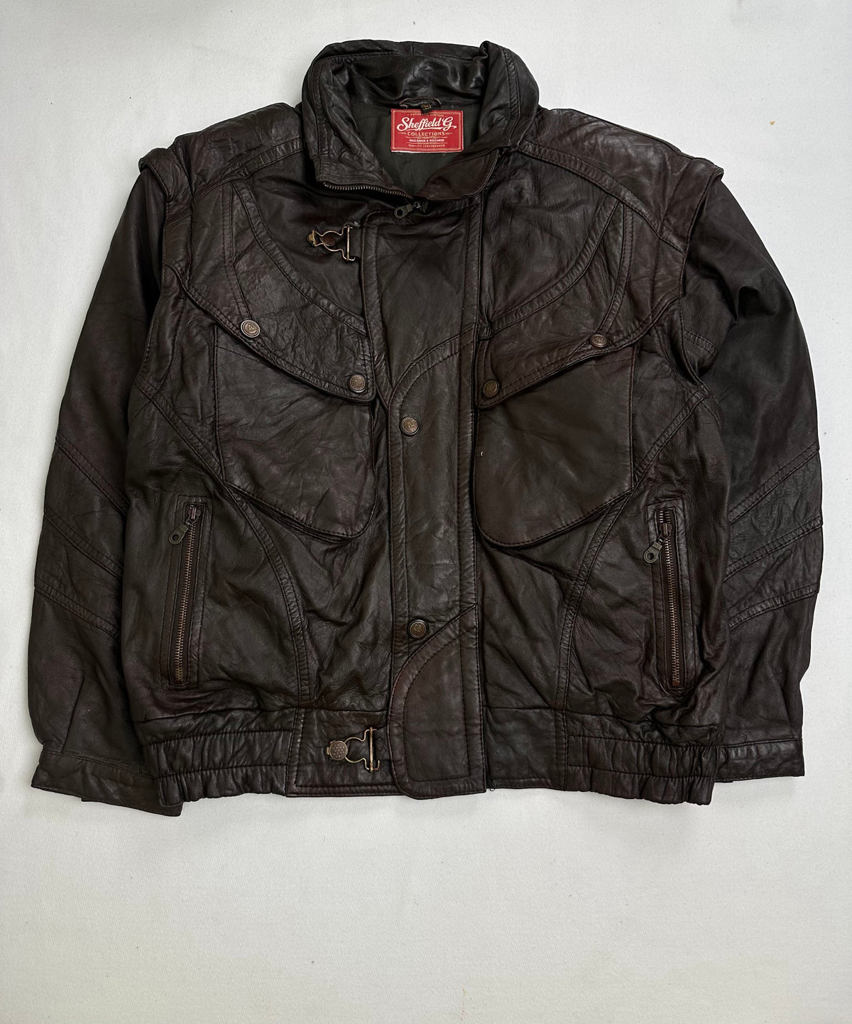 Back of the size XL brown vintage jacket laid flat