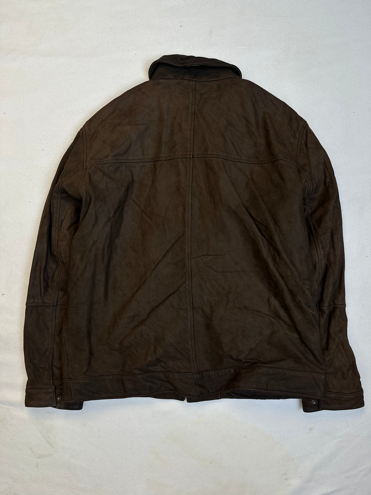 Back of the size XL brown leather vintage jacket, laid flat
