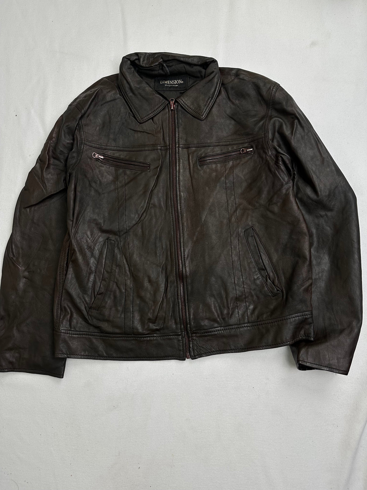 Back of the size L brown trucker jacket laid flat