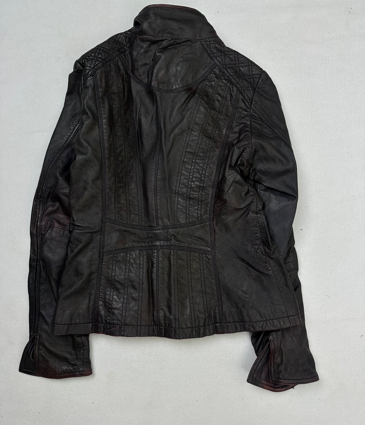 Back of the size S burgundy leather cafe racer jacket, laid flat