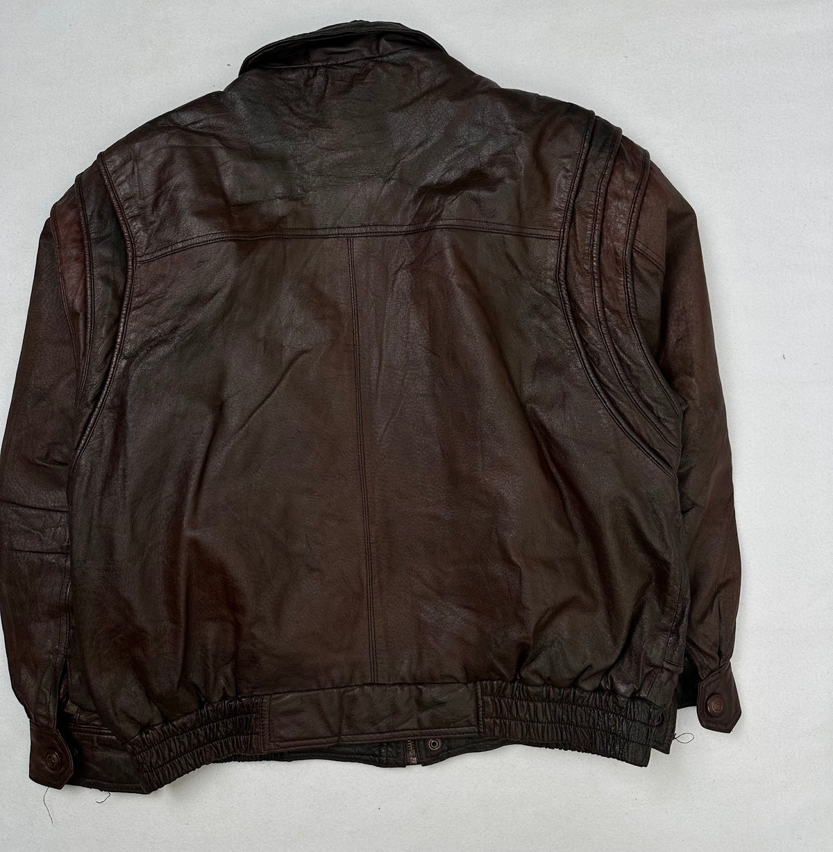 Back of the size L burgundy leather flight jacket, laid flat
