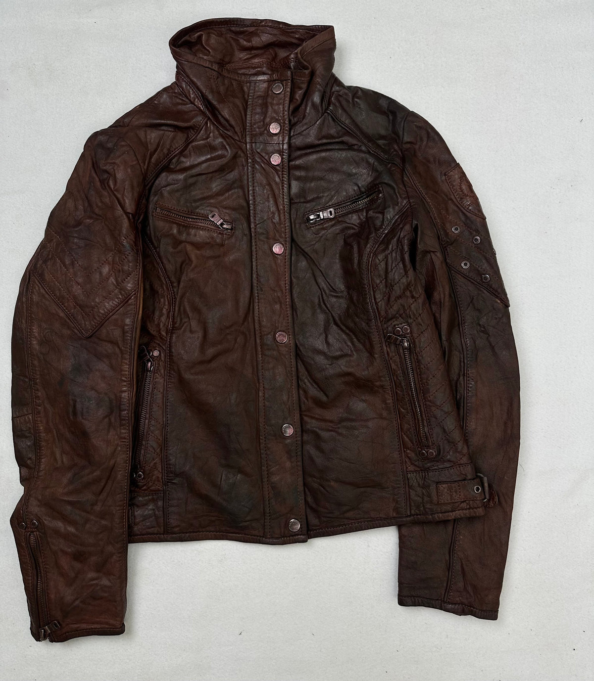 Front of the size S burgundy leather cafe racer jacket, laid flat and unedited