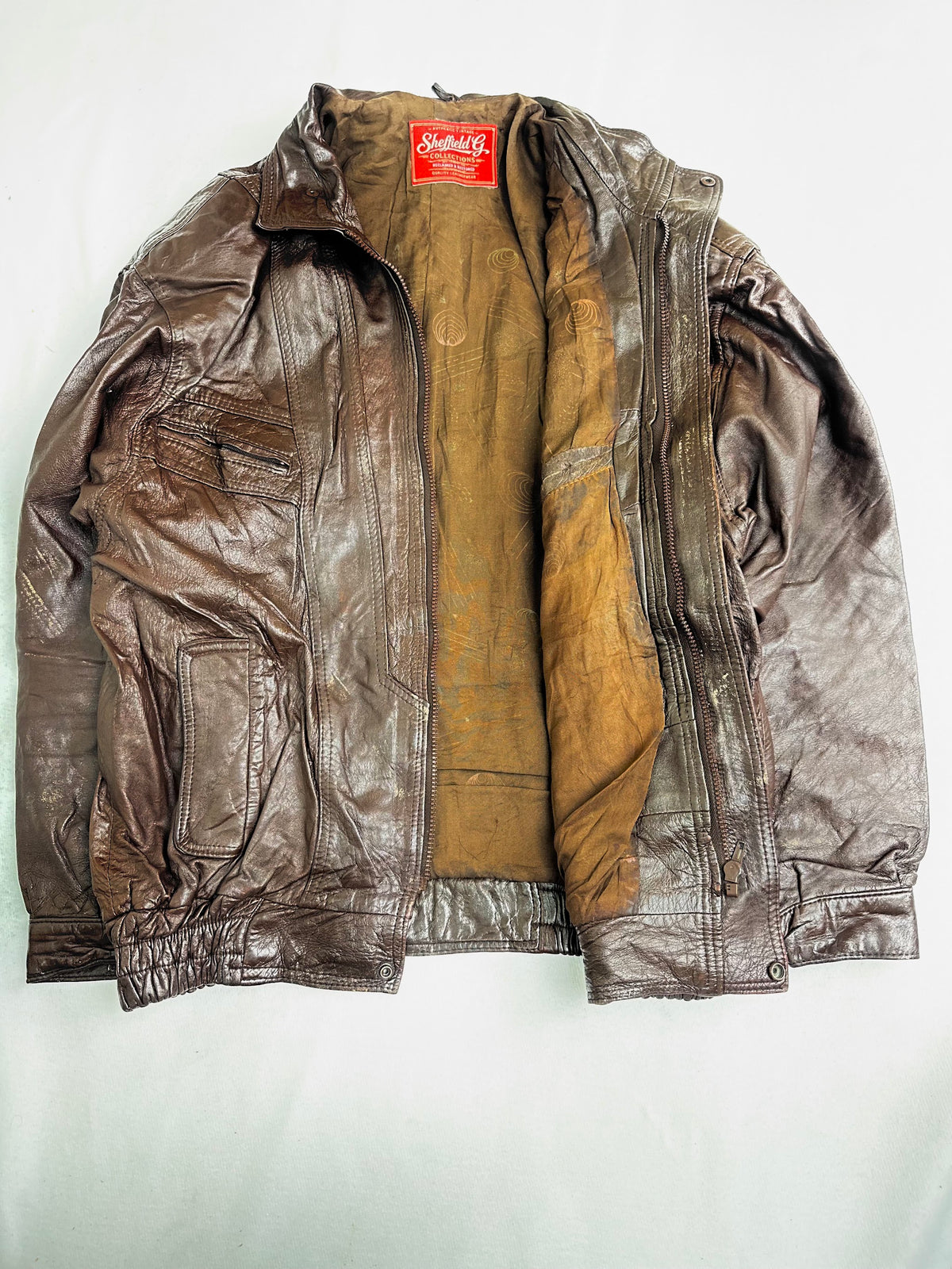 Tan and khaki-olive lining shown with the jacket open