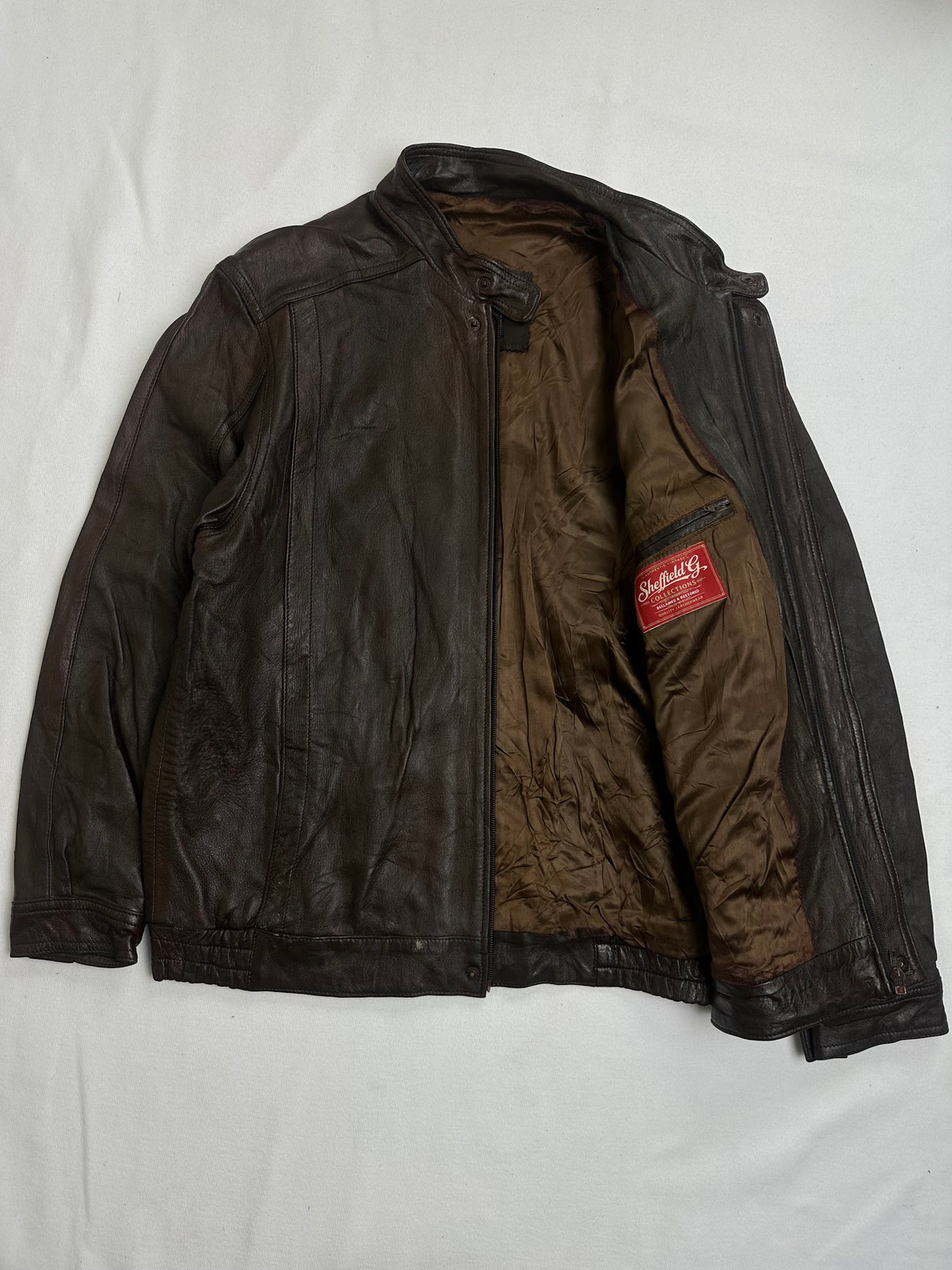 Olive lining shown with the brown cafe racer held open