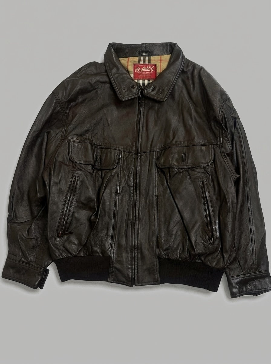 Brown leather flight jacket, size L, shown flat from the front. Tan check lining.