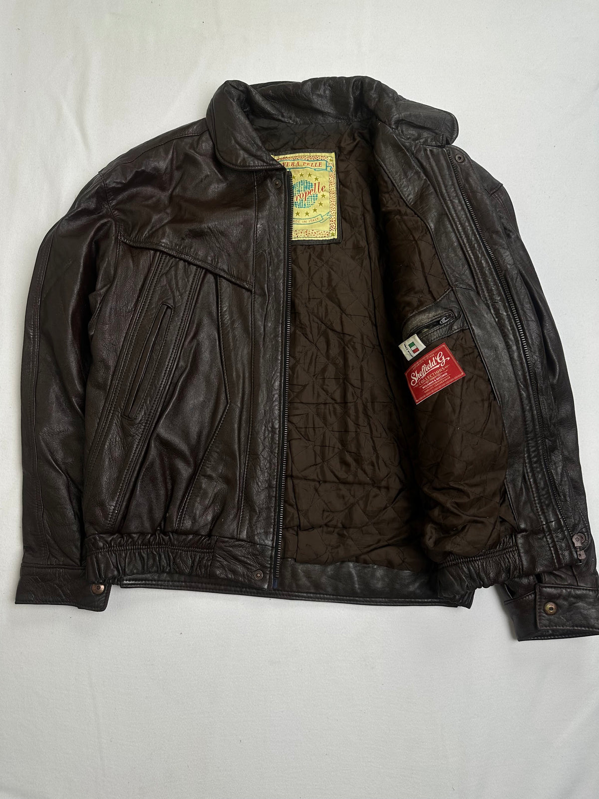 Dark brown quilted lining shown with the jacket held open