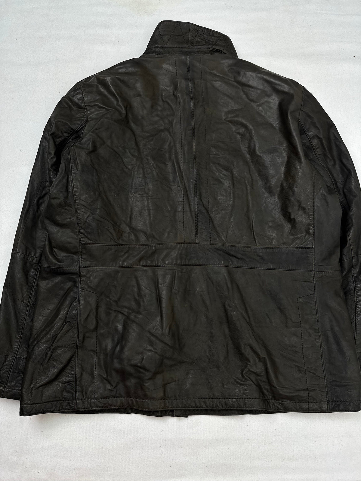 Back of the size XL brown leather field jacket, laid flat
