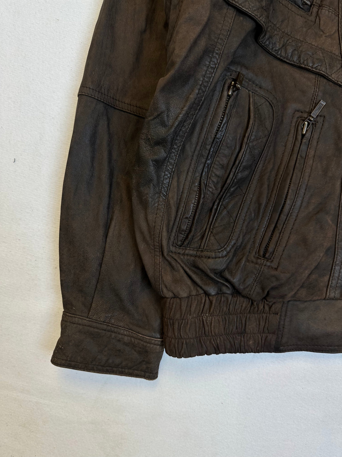 Close detail of the pockets and cuff on the size L brown leather flight jacket
