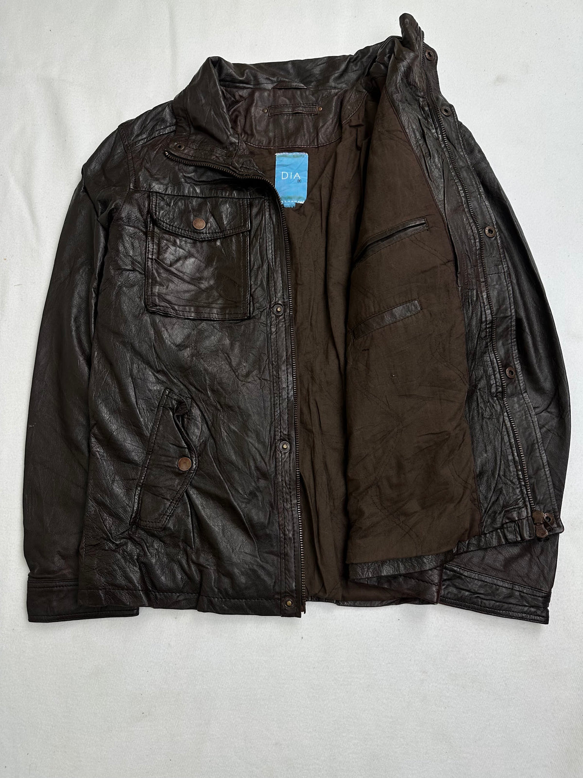 Interior zip and welt pockets shown in the open lining