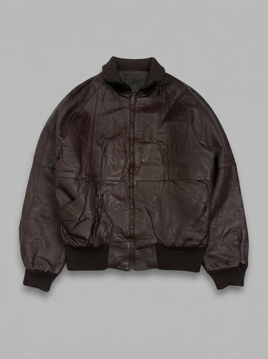 Brown leather bomber jacket, size L, shown flat from the front. Diamond quilted lining.