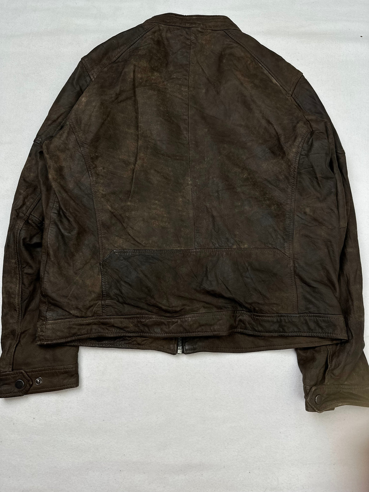 Back of the size M brown leather cafe racer jacket, laid flat
