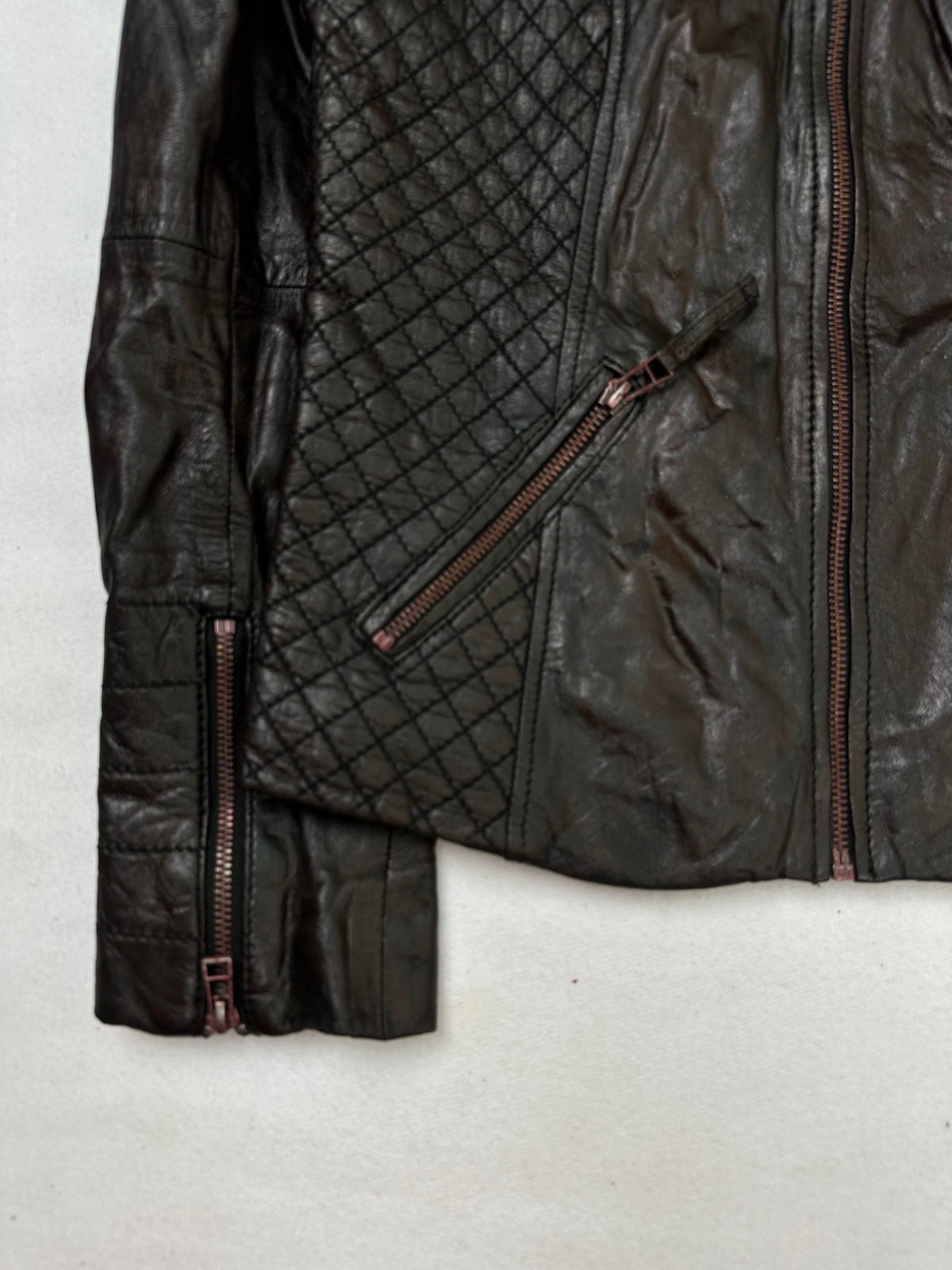 Close detail of the pockets and cuff on the size S brown leather cafe racer jacket