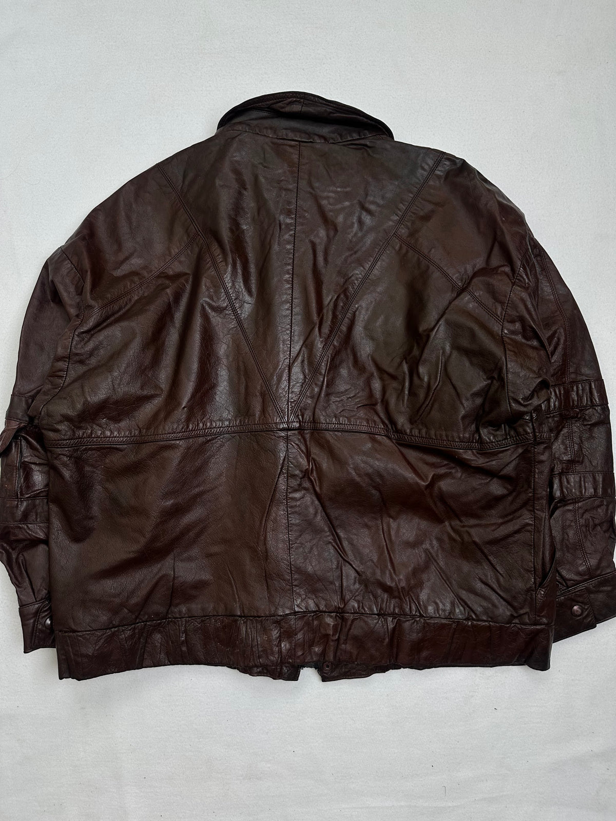 Back of the size M burgundy leather flight jacket, laid flat