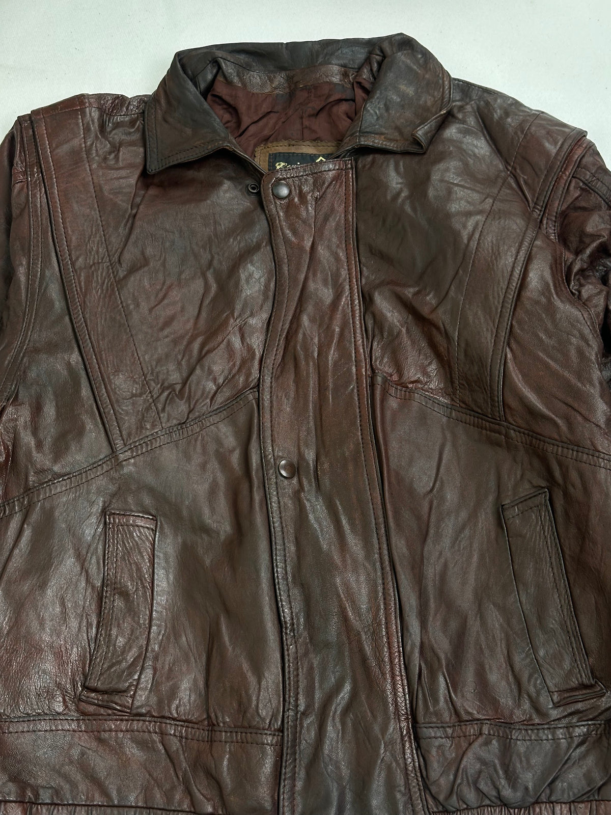 Brown woven lining shown with the harrington held open