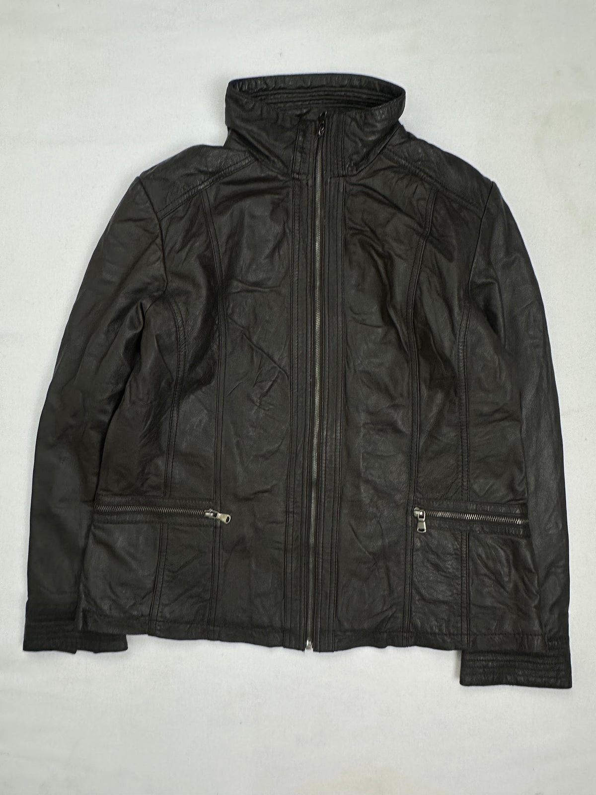 Front of the size S brown leather cafe racer jacket, laid flat and unedited