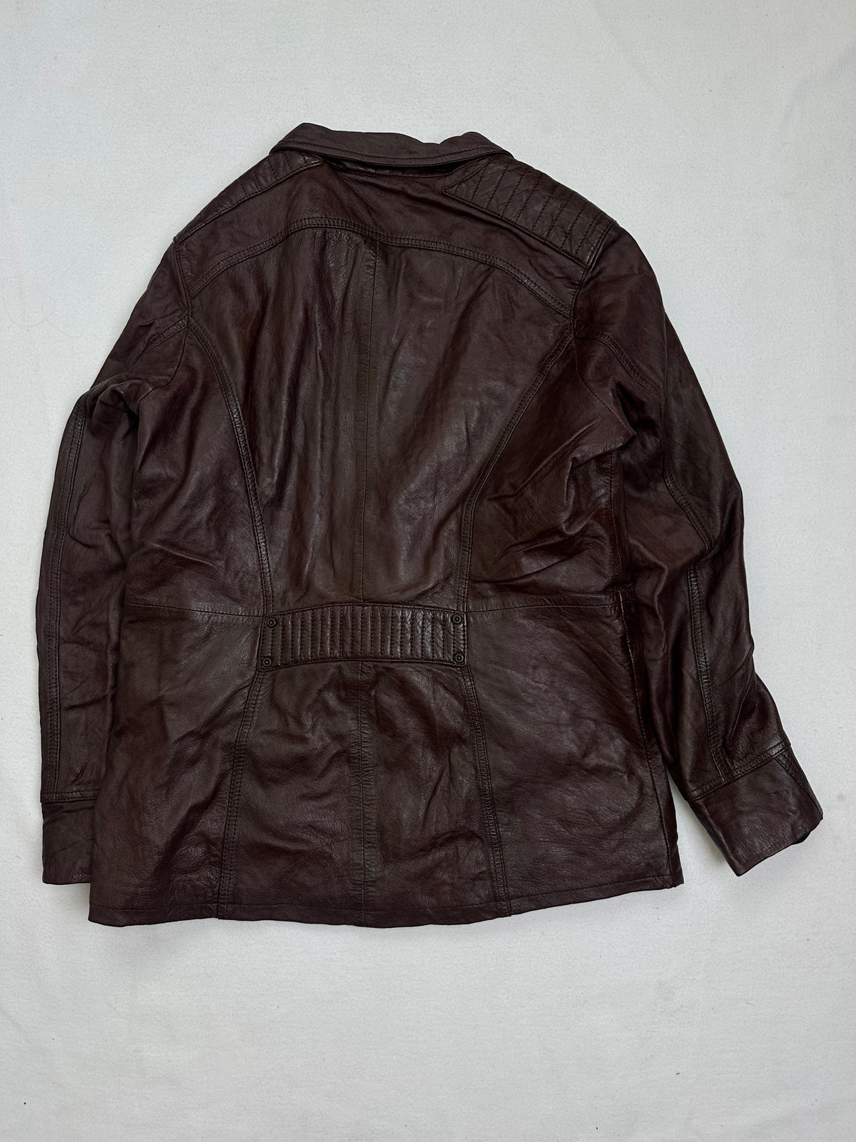 Back of the size M burgundy leather biker jacket, laid flat