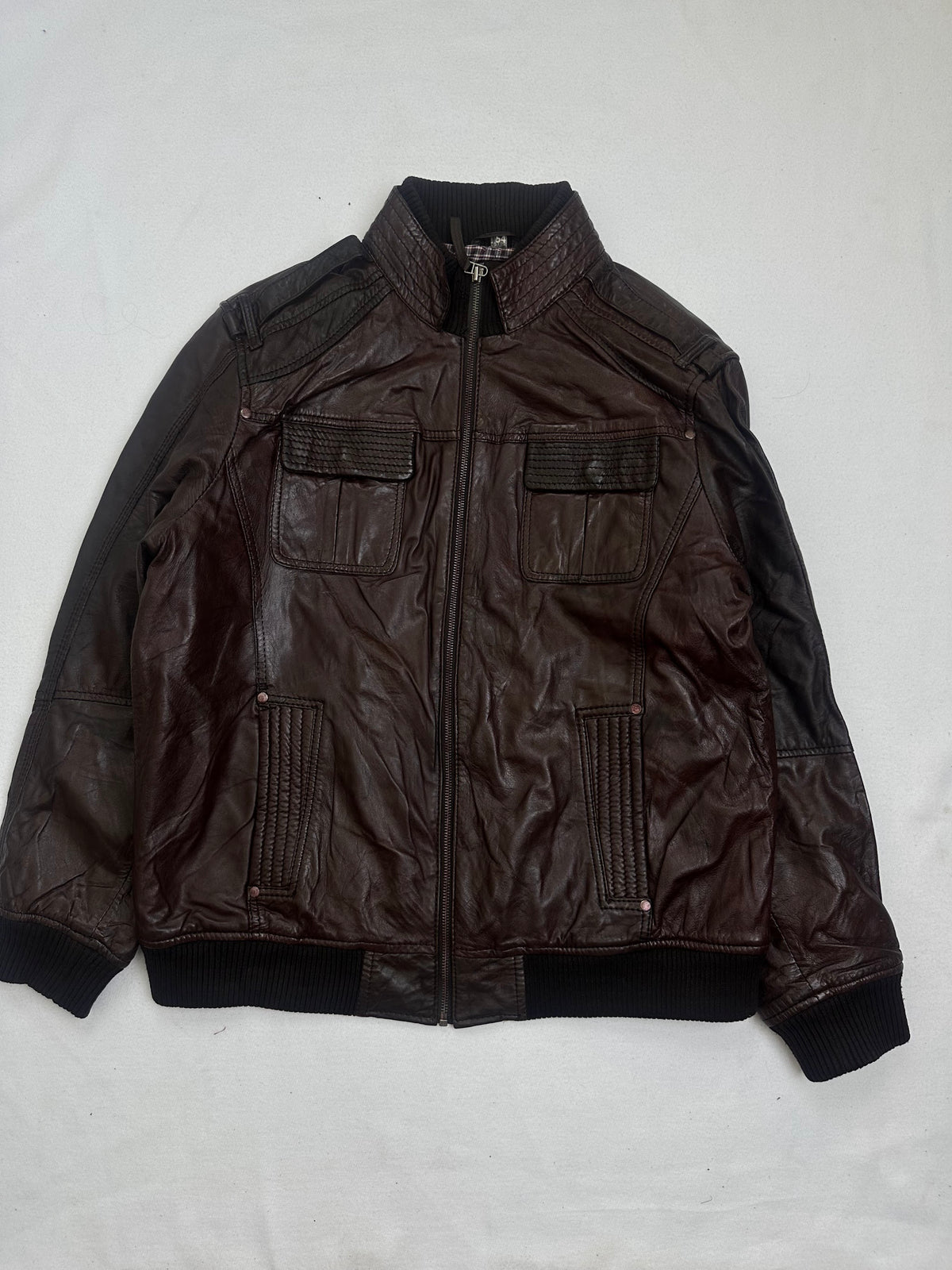 Front of the size L burgundy leather bomber jacket, laid flat and unedited