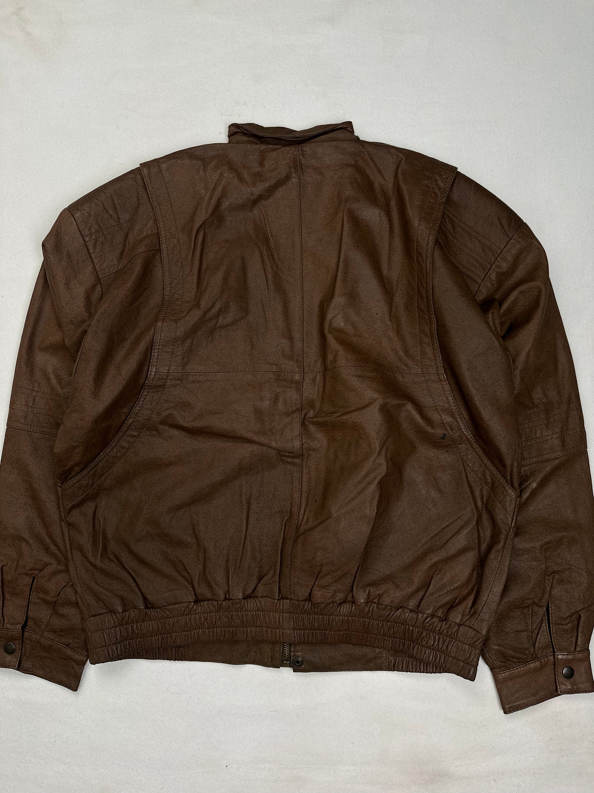 Leather stand collar above the straight centre zip