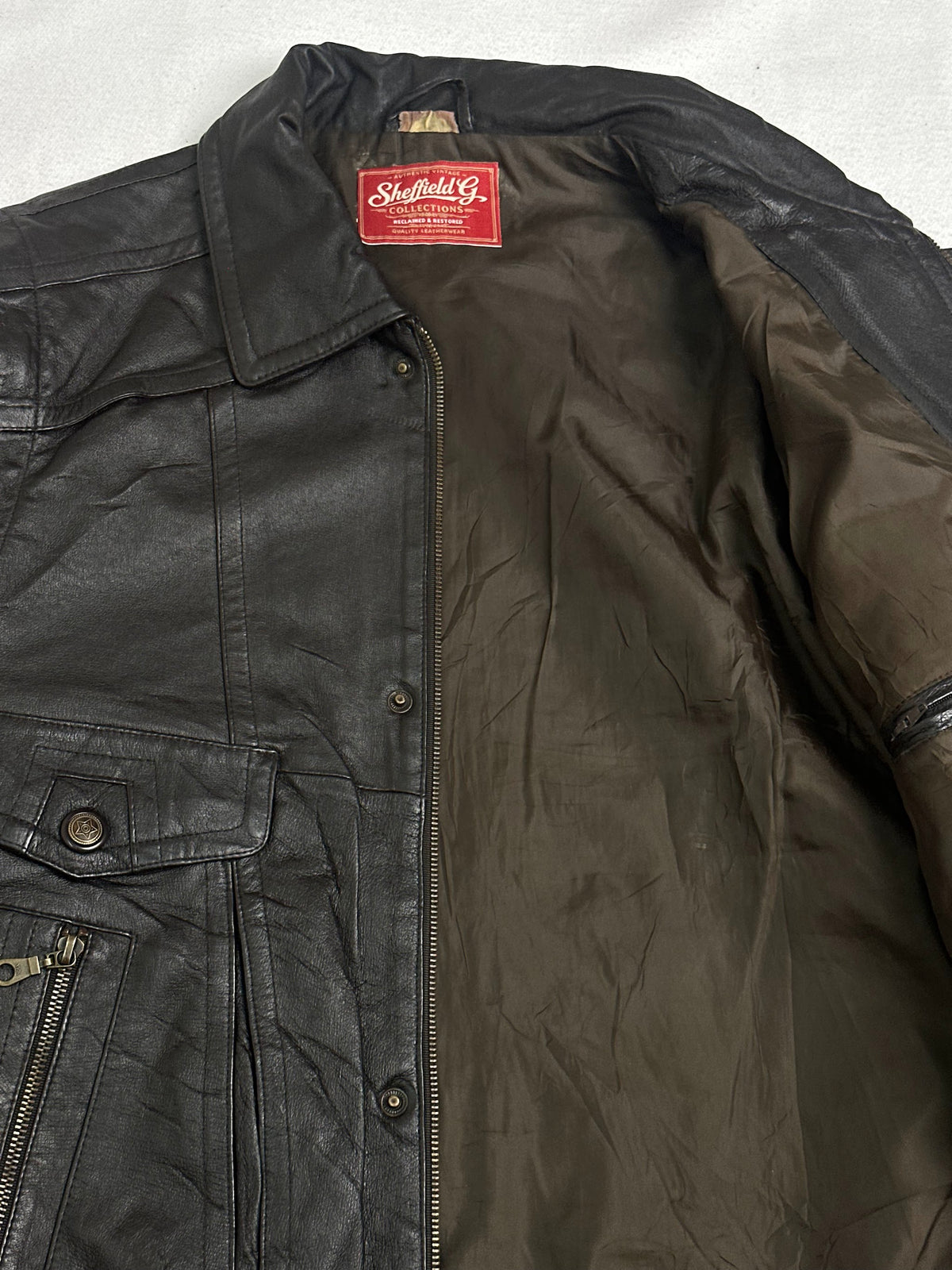 Khaki lining shown with the brown trucker held open