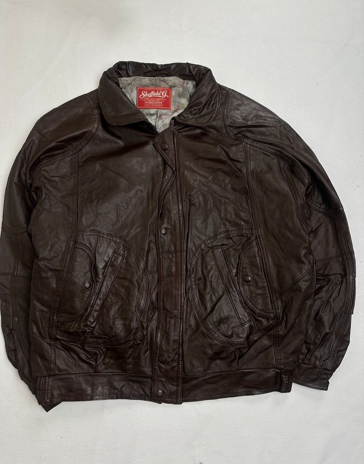 Back of the size L brown harrington laid flat
