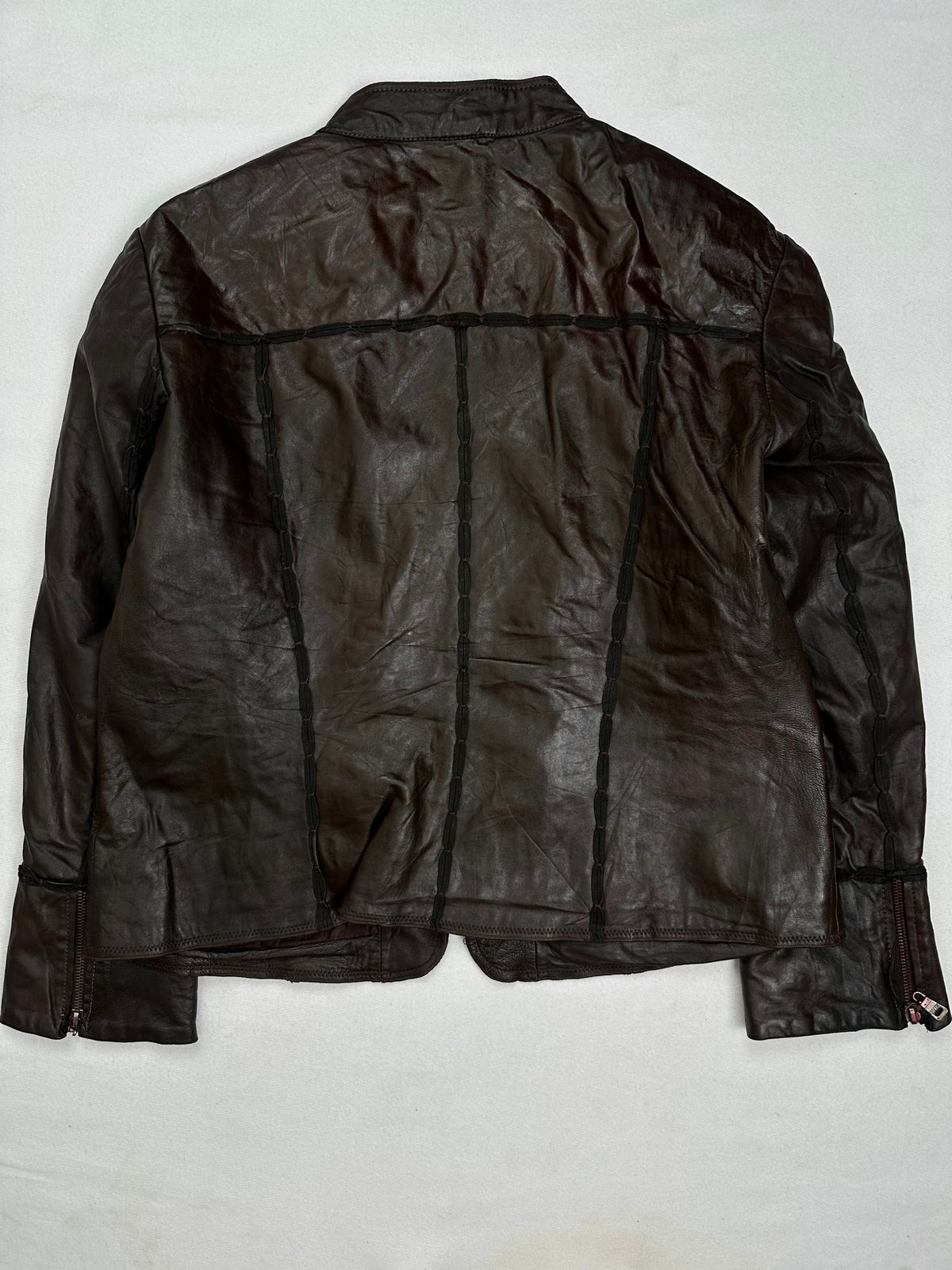 Back of the size S brown leather cafe racer jacket, laid flat