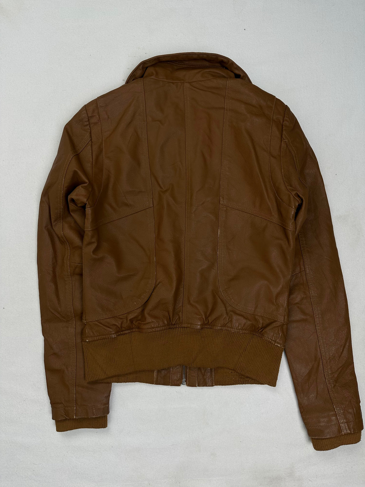 Ribbed knit collar above the straight centre zip