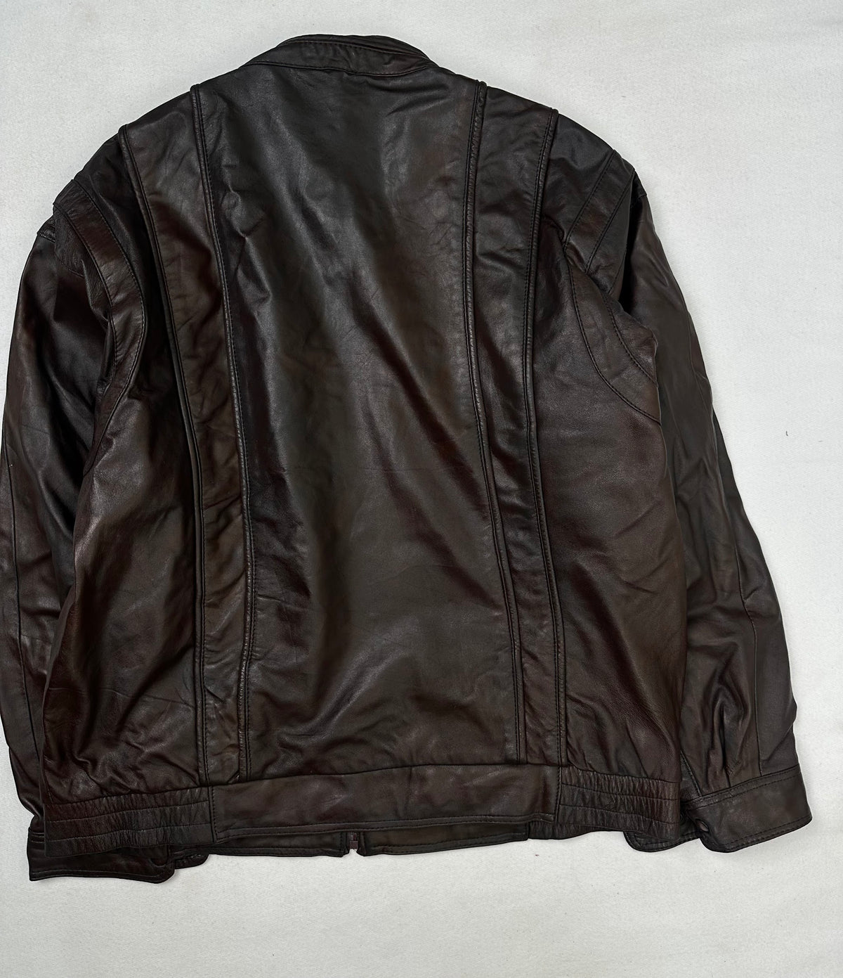 Back of the size L burgundy leather cafe racer jacket, laid flat