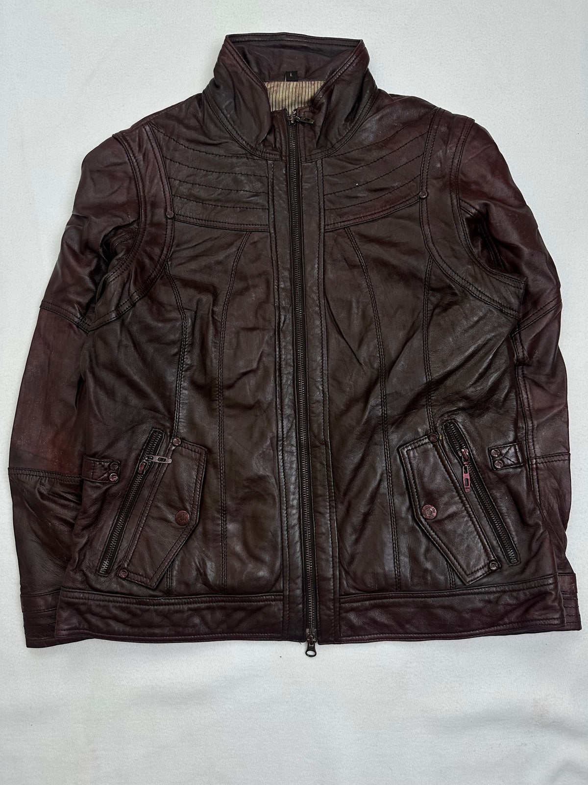 Front of the size M burgundy leather cafe racer jacket, laid flat and unedited