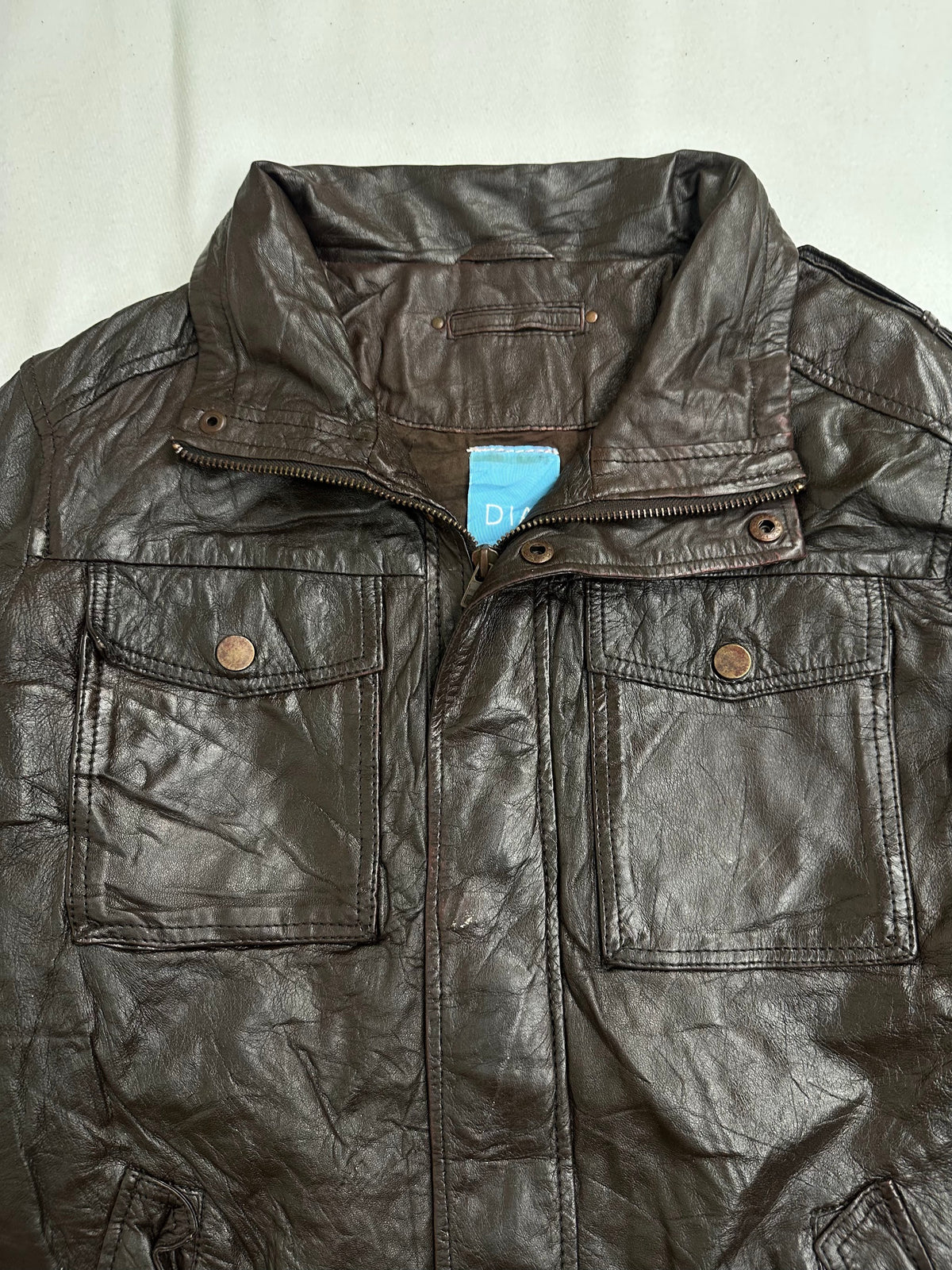 Chest flap pocket above a slanted hip pocket