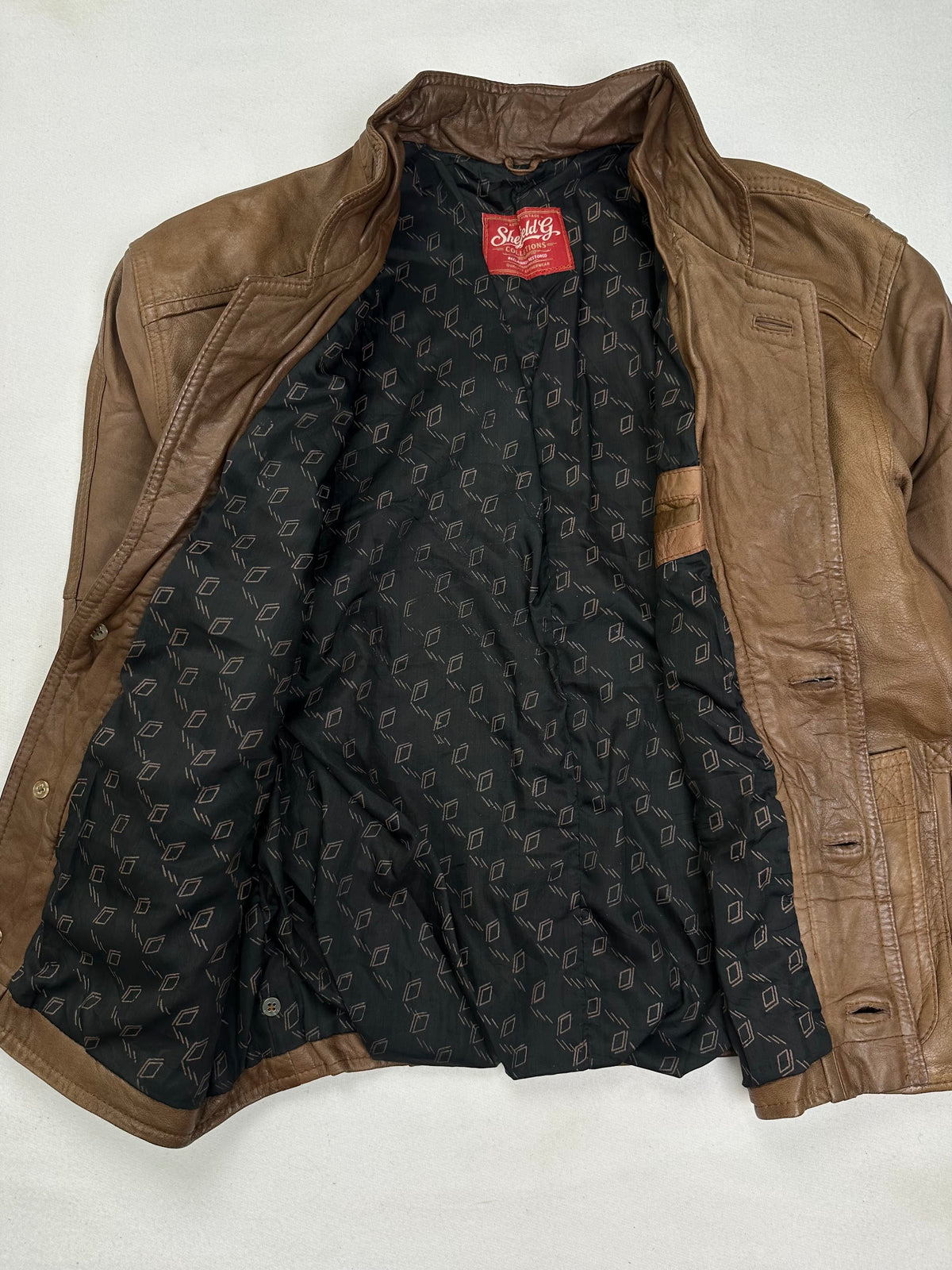 Black printed lining shown with the jacket held open